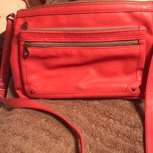 Relic crossbody; gently used;salmon color with metal accents